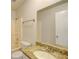 Bathroom with granite countertop, sink, and toilet at 2369 N Biscayne Dr, North Port, FL 34291