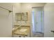 Bathroom boasts granite countertops and a double vanity at 2369 N Biscayne Dr, North Port, FL 34291