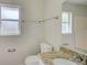Bathroom features granite countertop, sink, and toilet at 2369 N Biscayne Dr, North Port, FL 34291