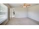 Bedroom with ceiling fan and view into kitchen at 2369 N Biscayne Dr, North Port, FL 34291