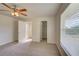 Spacious bedroom featuring carpet flooring and ample closet space at 2369 N Biscayne Dr, North Port, FL 34291