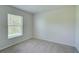 Bright bedroom with window, blinds, and neutral walls at 2369 N Biscayne Dr, North Port, FL 34291