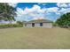 Backyard of the house showing a grassy area at 2369 N Biscayne Dr, North Port, FL 34291