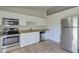 Modern kitchen with stainless steel appliances and granite countertops at 2369 N Biscayne Dr, North Port, FL 34291