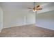 Spacious living room with tile floors and ceiling fan at 2369 N Biscayne Dr, North Port, FL 34291