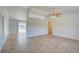Bright living room with tile floors and ceiling fan at 2369 N Biscayne Dr, North Port, FL 34291
