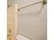 Clean shower with a shower head and a rod for hanging towels at 2369 N Biscayne Dr, North Port, FL 34291
