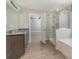 Main bathroom features a large vanity, walk in shower, and garden tub at 2436 Sand Gables Trl, Bradenton, FL 34208