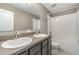 Shared bathroom with double sinks and a shower/tub combo at 2436 Sand Gables Trl, Bradenton, FL 34208