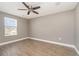 Spacious bedroom with ceiling fan and large window at 2436 Sand Gables Trl, Bradenton, FL 34208