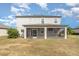 Rear view of two-story house with large screened porch at 2436 Sand Gables Trl, Bradenton, FL 34208