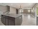 Kitchen island overlooks a large living area with wood-look floors at 2436 Sand Gables Trl, Bradenton, FL 34208