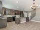Modern kitchen with granite countertops and dark wood cabinets at 2436 Sand Gables Trl, Bradenton, FL 34208