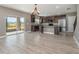 Open concept kitchen features granite island and stainless steel appliances at 2436 Sand Gables Trl, Bradenton, FL 34208