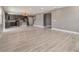Open living room with kitchen and stairs at 2436 Sand Gables Trl, Bradenton, FL 34208