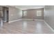 Living room with gray walls and wood-look flooring at 2436 Sand Gables Trl, Bradenton, FL 34208