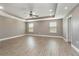 Large main bedroom with ceiling fan and wood-look floors at 2436 Sand Gables Trl, Bradenton, FL 34208