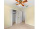 Bedroom with double door closet and access to hallway at 2699 56Th N Ln, St Petersburg, FL 33710