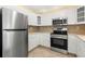 Well-equipped kitchen with stainless steel appliances and ample counter space at 2699 56Th N Ln, St Petersburg, FL 33710