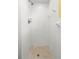 Clean shower with white tile and a built-in shelf at 2699 56Th N Ln, St Petersburg, FL 33710