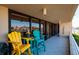 Balcony with colorful chairs and water views at 2795 Kipps Colony S Dr # 104, St Petersburg, FL 33707