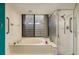 Bathroom with a large tub, shower, and updated fixtures at 2795 Kipps Colony S Dr # 104, St Petersburg, FL 33707