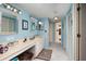 Bathroom with double vanity, light blue walls, and a tiled floor at 2795 Kipps Colony S Dr # 104, St Petersburg, FL 33707