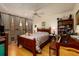 Bedroom with wood bed frame and access to balcony at 2795 Kipps Colony S Dr # 104, St Petersburg, FL 33707