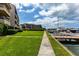 Waterfront walkway next to boat docks and building at 2795 Kipps Colony S Dr # 104, St Petersburg, FL 33707
