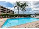 Sparkling community pool with surrounding patio at 2795 Kipps Colony S Dr # 104, St Petersburg, FL 33707