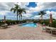 Inviting community pool with lounge chairs and umbrellas at 2795 Kipps Colony S Dr # 104, St Petersburg, FL 33707