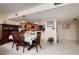 Dining room with wood table and chairs, view of kitchen at 2795 Kipps Colony S Dr # 104, St Petersburg, FL 33707
