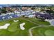 Aerial view of a golf course and clubhouse near the water at 2795 Kipps Colony S Dr # 104, St Petersburg, FL 33707