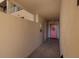 Interior hallway with pink door and white walls at 2795 Kipps Colony S Dr # 104, St Petersburg, FL 33707