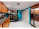 Condo kitchen with wood cabinets, stainless steel appliances, and breakfast nook at 2795 Kipps Colony S Dr # 104, St Petersburg, FL 33707