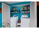 Laundry room with washer, dryer, and shelving at 2795 Kipps Colony S Dr # 104, St Petersburg, FL 33707