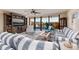 Bright living room with water views, comfortable seating, and built-in shelving at 2795 Kipps Colony S Dr # 104, St Petersburg, FL 33707