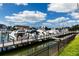 Boats docked at a marina with a wooden pier at 2795 Kipps Colony S Dr # 104, St Petersburg, FL 33707