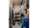 Large storage room with shelving and hanging rods at 2795 Kipps Colony S Dr # 104, St Petersburg, FL 33707