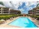 Inviting community pool with ample lounge chairs at 2795 Kipps Colony S Dr # 104, St Petersburg, FL 33707