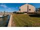 Waterfront view with boat slips and grassy areas at 2795 Kipps Colony S Dr # 104, St Petersburg, FL 33707