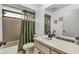 Clean bathroom with shower/tub combo and updated vanity at 3028 Summervale Dr, Holiday, FL 34691