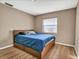 Cozy bedroom with a full-size bed and ample closet space at 3028 Summervale Dr, Holiday, FL 34691