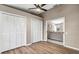 Bright bonus room with double closets and views into the living area at 3028 Summervale Dr, Holiday, FL 34691