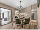 Bright dining room with a round wooden table and black chairs at 3028 Summervale Dr, Holiday, FL 34691