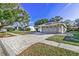 Property showcasing a brick-paved driveway and walkway at 3028 Summervale Dr, Holiday, FL 34691