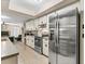 Modern kitchen features stainless steel appliances and ample cabinetry at 3028 Summervale Dr, Holiday, FL 34691
