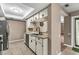 Kitchen with stainless steel dishwasher and a view into the living room at 3028 Summervale Dr, Holiday, FL 34691