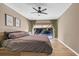 Main bedroom with ceiling fan and sliding doors leading to the pool at 3028 Summervale Dr, Holiday, FL 34691