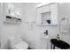 Small bathroom with toilet and pedestal sink at 3031 W Asbury Pl, Tampa, FL 33611